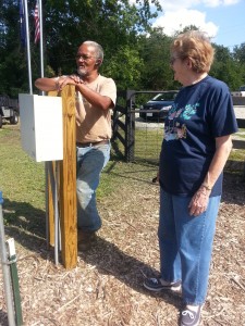 Irene and Wayne Riley discussing the community garden.  