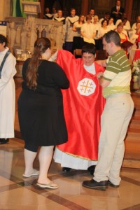 My children vesting me at my ordination, July 27, 2013. Symbol is The Jerusalem Cross.